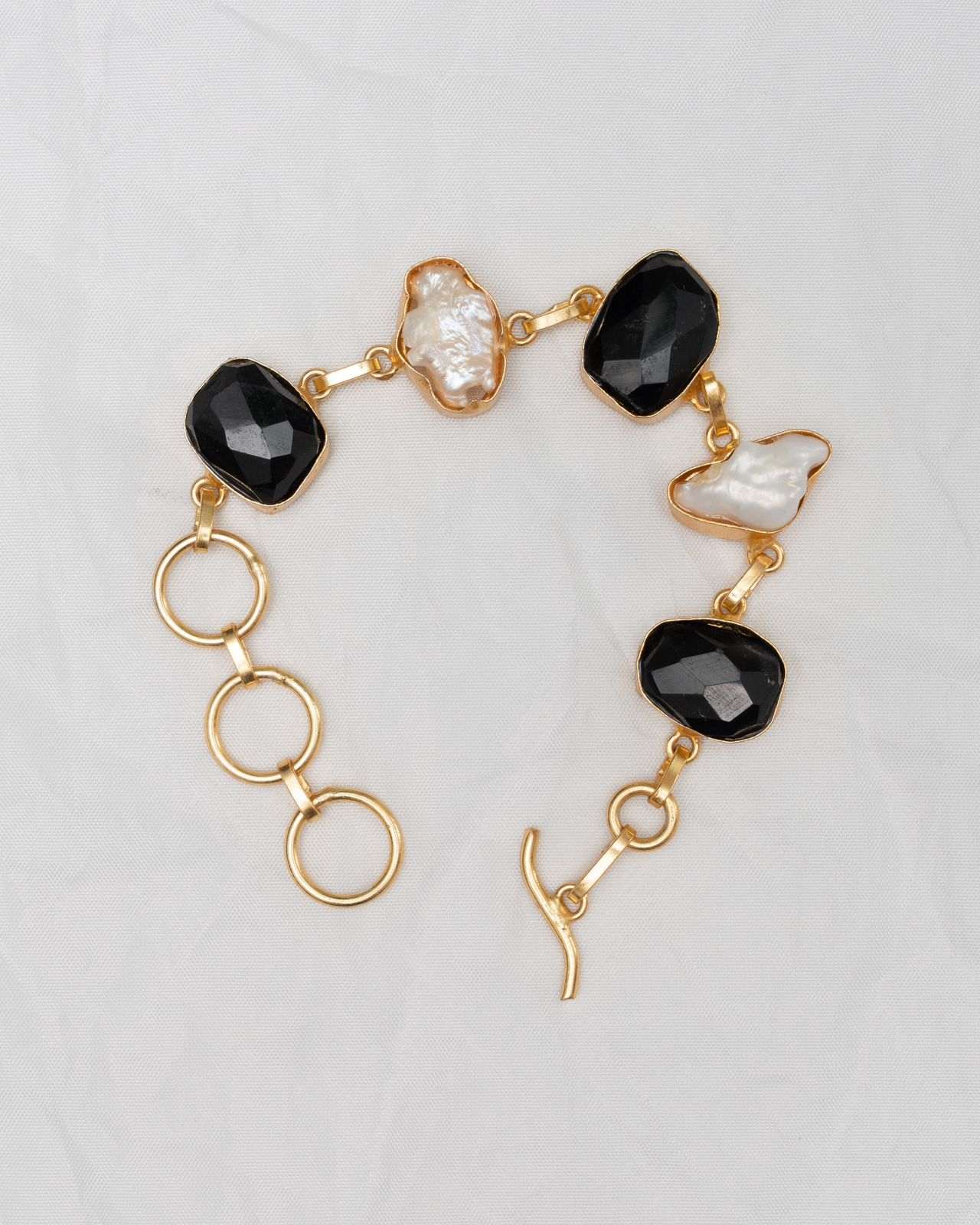 Enigmatic Allure: Black Faceted Onyx Bracelet