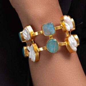 Embrace the calming beauty of the ocean with this sophisticated pearl and blue calcite bracelet.