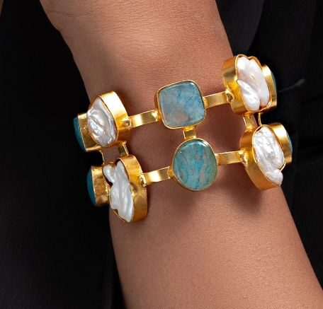 Embrace the calming beauty of the ocean with this sophisticated pearl and blue calcite bracelet.
