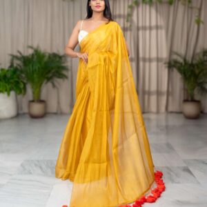 Golden Radiance: Raga Tissue Saree with Big Orange Pom-Poms